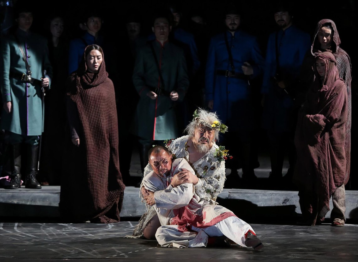 Pu Cunxin as King Lear, holding Wei Xiaoping as the Earl of Gloucester, in a production of King Lear in Beijing