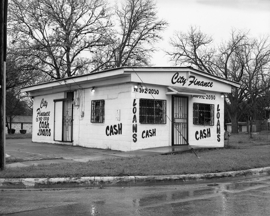 A small building displaying the words "cash" and "loans"