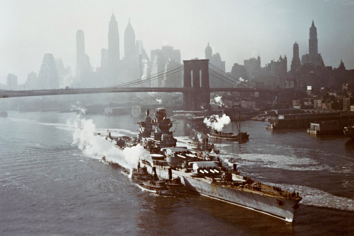 French battleship Richelieu being maneuvered by tugboats up the East River, New York City, 1943